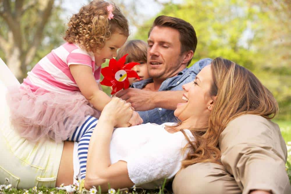 family playing together resting